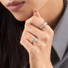 Six prong round lab diamond engagement ring on model.