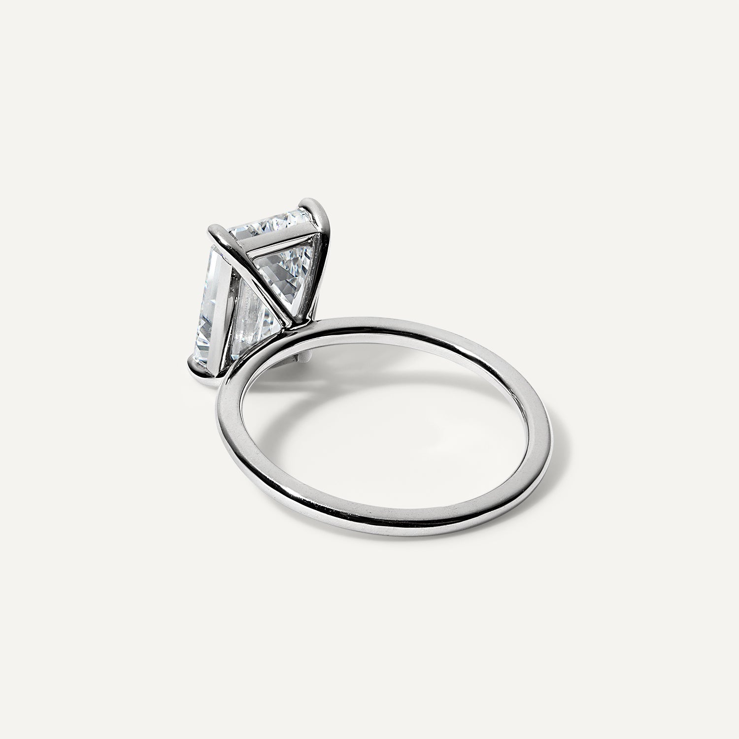 Emerald lab diamond engagement ring.