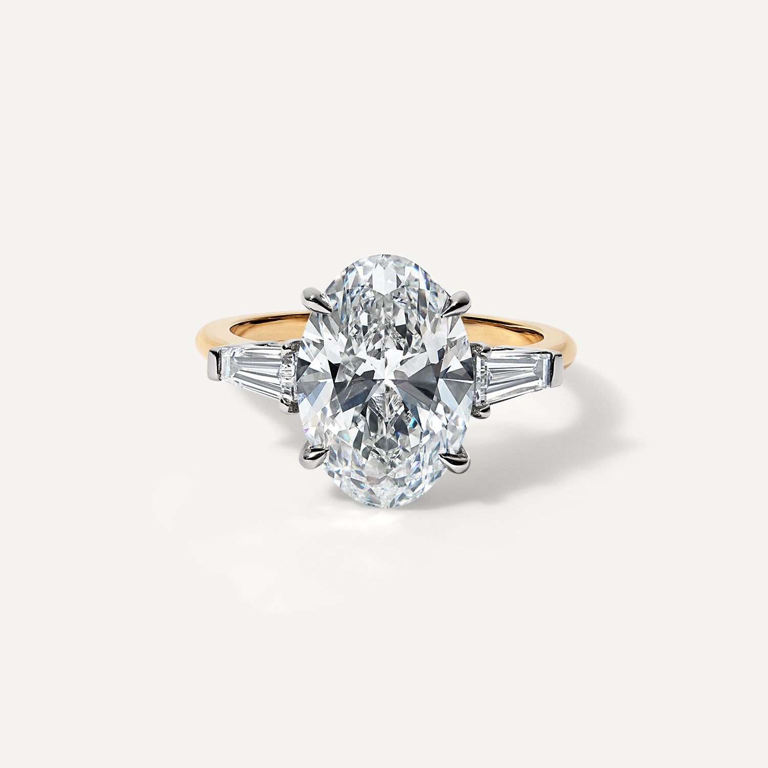 Oval three stone lab diamond engagement ring.