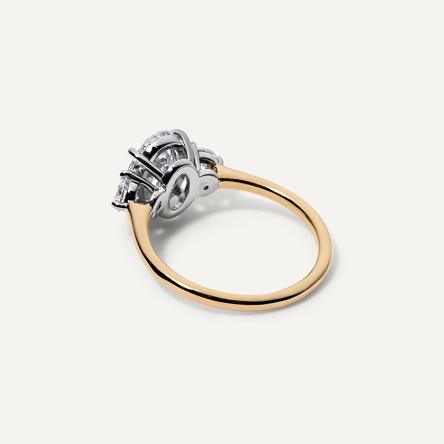 Three stone oval lab diamond engagement ring.