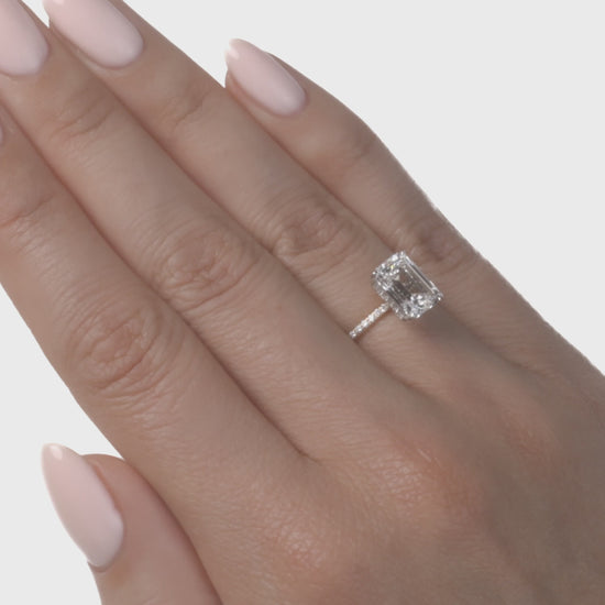 video of Emerald lab diamond engagement ring.