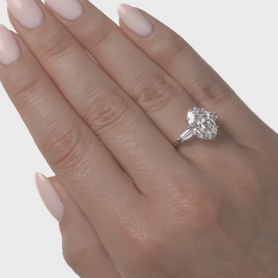 video of three stone oval diamond engagement ring.