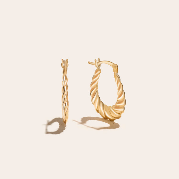 Gold croissant hoop earrings.